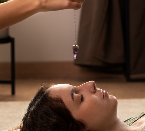 Woman receiving crystal therapy