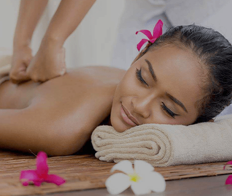 Relaxing back massage with flowers and towel